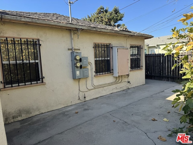 view of property exterior with a patio