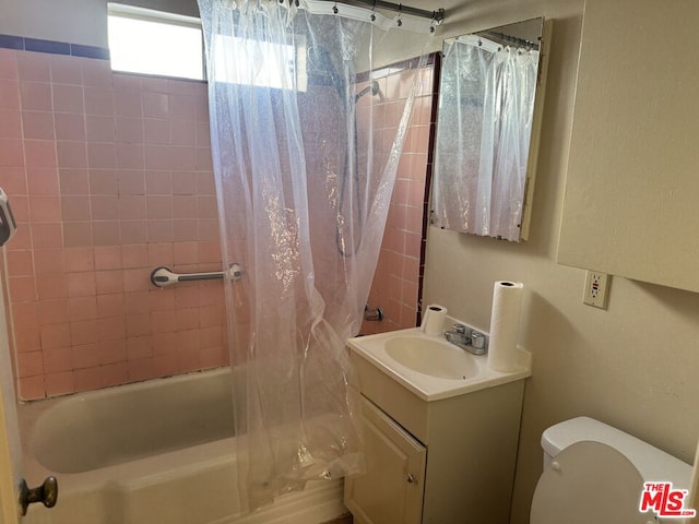 full bathroom featuring vanity, toilet, and shower / bathtub combination with curtain