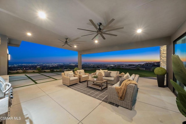 patio terrace at dusk featuring an outdoor living space