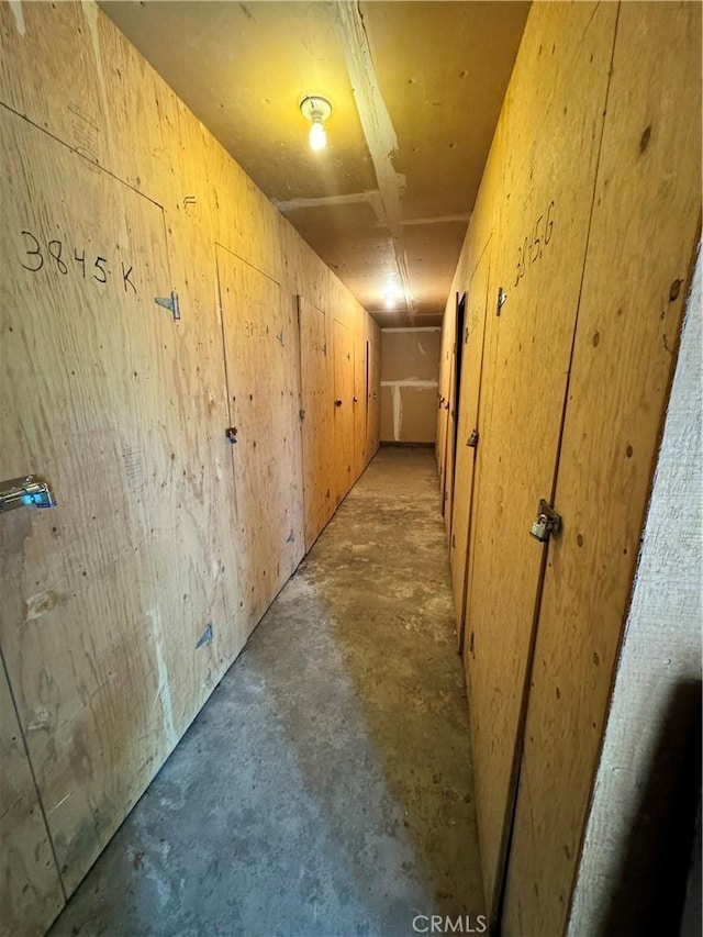 hallway with concrete flooring