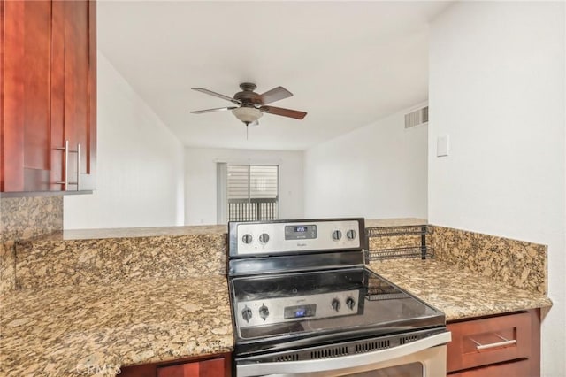 kitchen with ceiling fan, tasteful backsplash, light stone counters, and stainless steel electric range