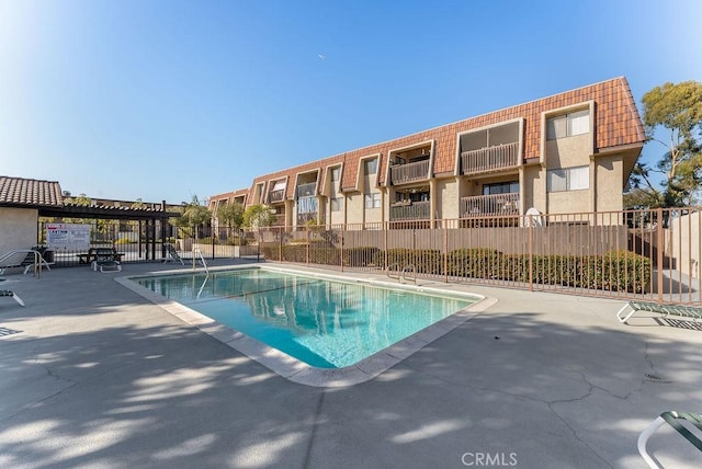 view of swimming pool with a patio area