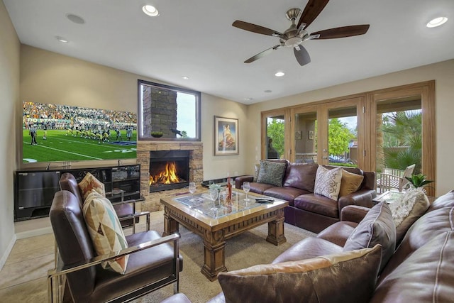 living room with ceiling fan, light tile patterned floors, and a fireplace