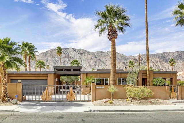 view of front of house with a mountain view and a garage