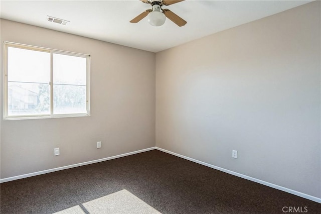 unfurnished room with ceiling fan and carpet floors