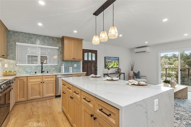 kitchen with dishwasher, sink, electric range oven, a kitchen island, and light wood-type flooring