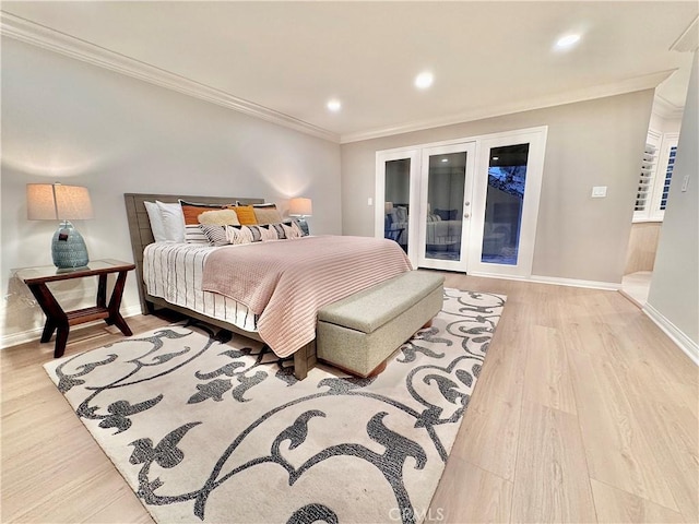 bedroom with access to exterior, light hardwood / wood-style flooring, ornamental molding, and french doors