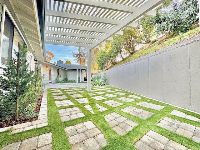 view of yard featuring a pergola and a patio