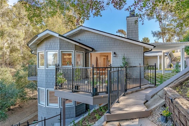 rear view of property with a deck