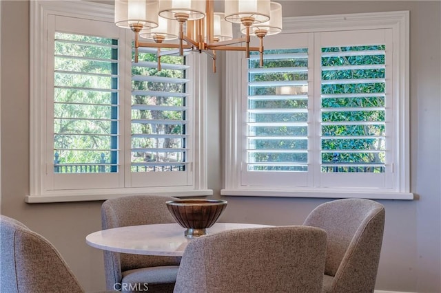 dining room with an inviting chandelier and a wealth of natural light