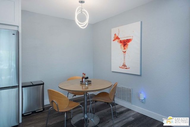 dining room featuring dark wood-type flooring