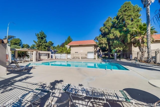 view of swimming pool with a patio area