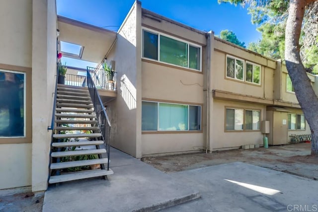 view of side of home with a patio