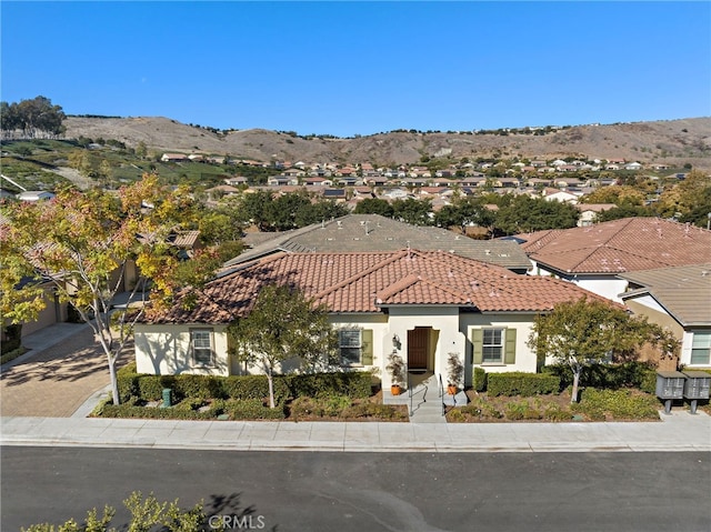 mediterranean / spanish house featuring a mountain view