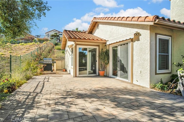 rear view of property featuring a patio area