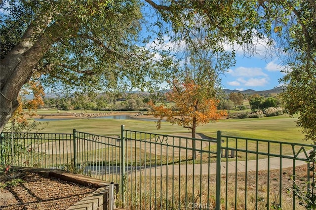 view of yard with a water and mountain view