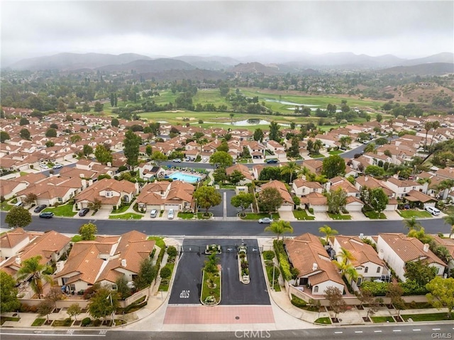 birds eye view of property featuring a mountain view