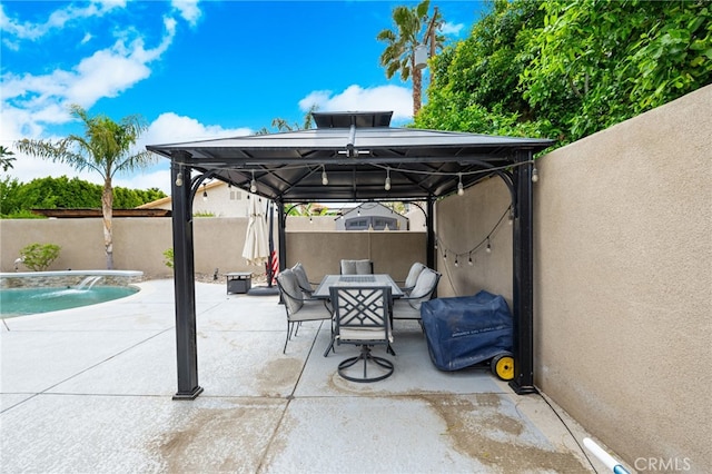 view of patio / terrace with an outdoor living space, a fenced in pool, pool water feature, a gazebo, and a grill