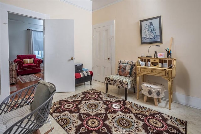 sitting room featuring crown molding