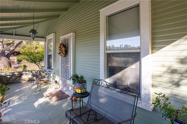 view of patio featuring a porch