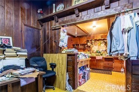 misc room featuring wooden walls