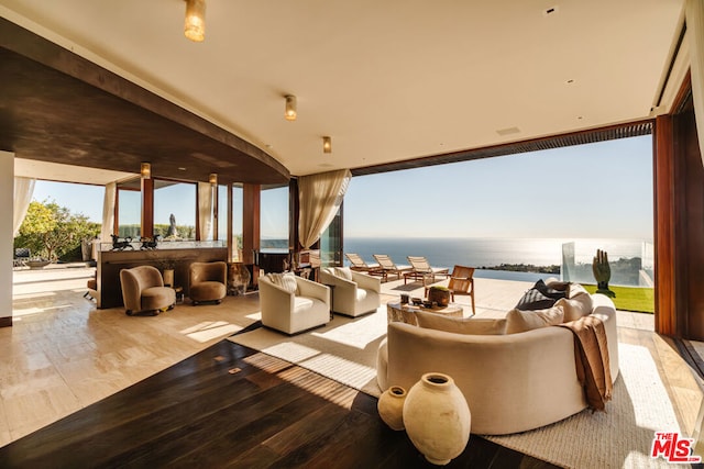 view of patio / terrace with an outdoor living space and a water view