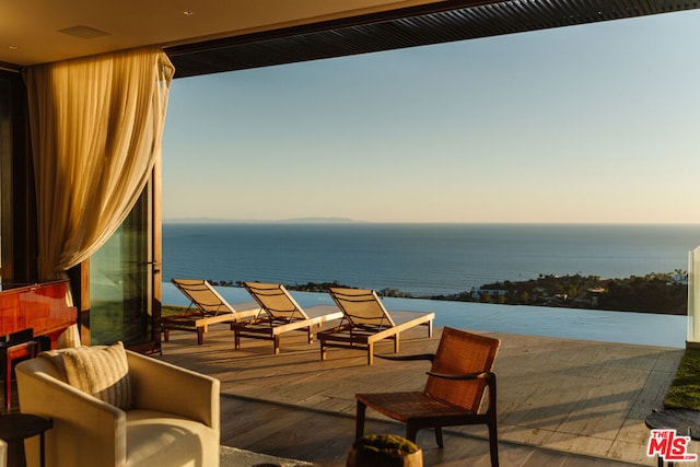 patio terrace at dusk with a water view