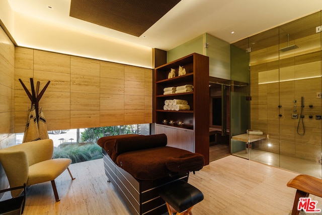 sitting room with wood-type flooring