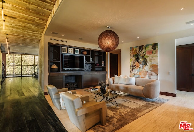 living room with hardwood / wood-style flooring and expansive windows