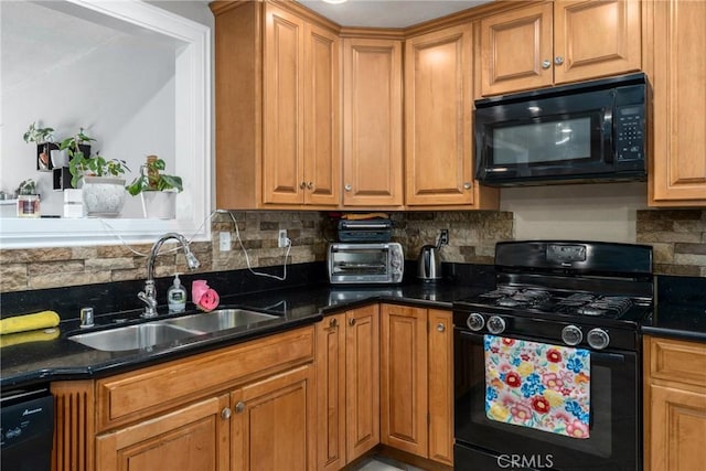 kitchen featuring tasteful backsplash, sink, black appliances, and dark stone countertops