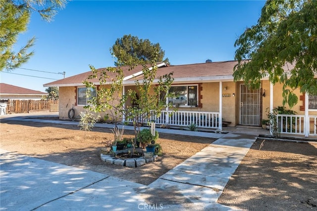 ranch-style house with covered porch