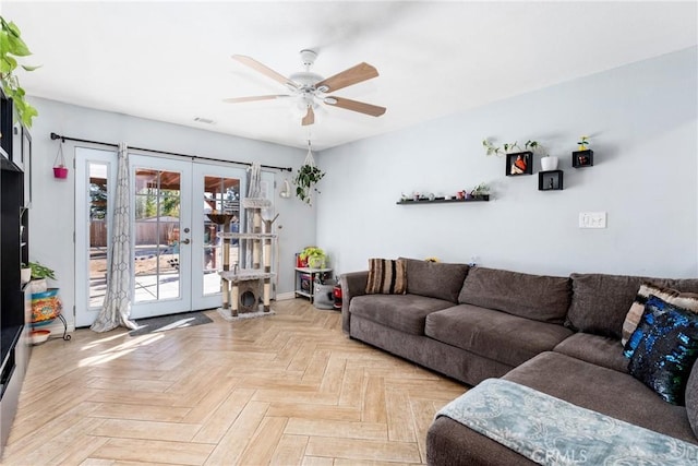 living room featuring ceiling fan, french doors, and light parquet flooring