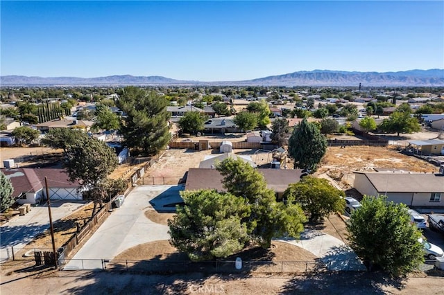 birds eye view of property featuring a mountain view