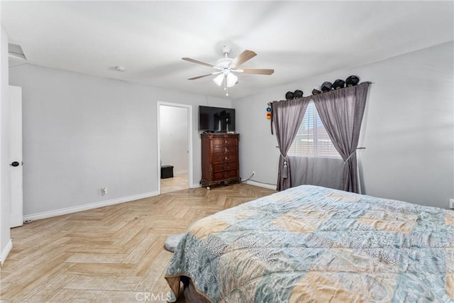 bedroom featuring ceiling fan and light parquet flooring