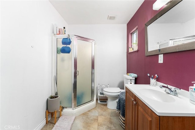 bathroom featuring vanity, an enclosed shower, tile patterned flooring, and toilet