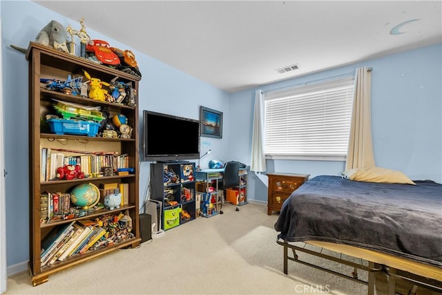 bedroom with light carpet