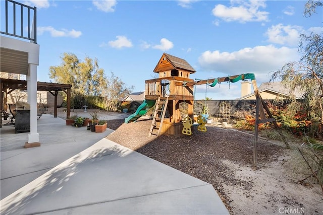 view of playground featuring a patio area