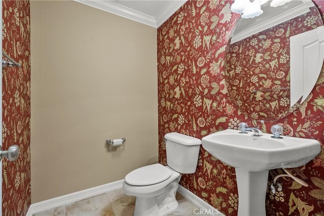 bathroom with crown molding and toilet