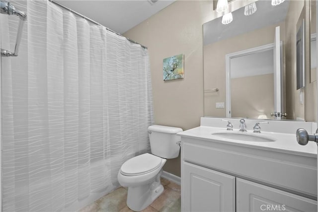 bathroom with tile patterned floors, vanity, and toilet