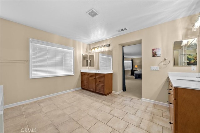 bathroom featuring tile patterned floors and vanity