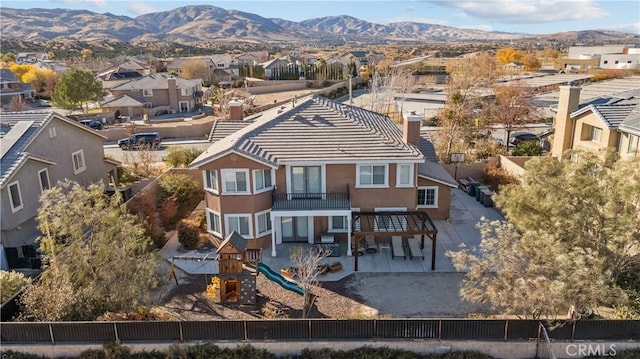 birds eye view of property featuring a mountain view