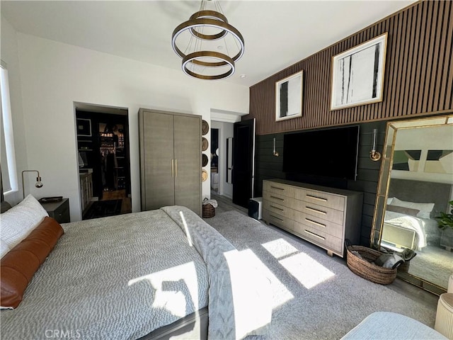 bedroom featuring light carpet and a closet