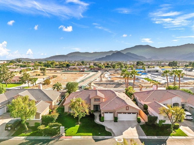 birds eye view of property featuring a mountain view