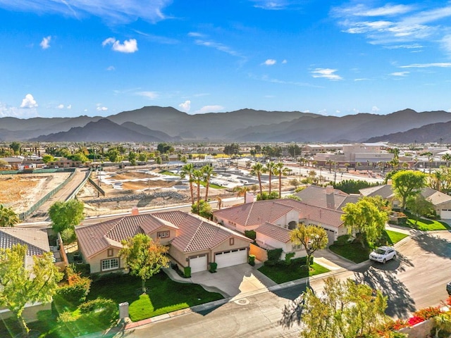 birds eye view of property with a mountain view