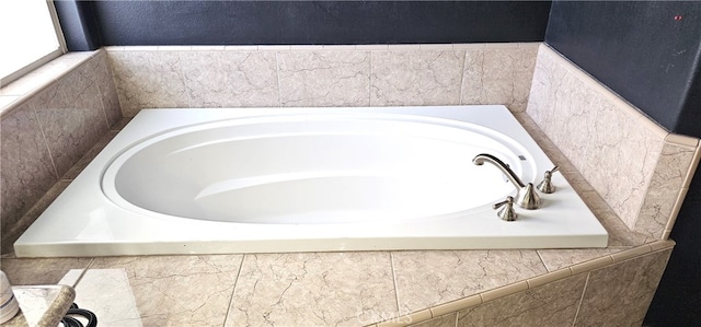 bathroom with a relaxing tiled tub