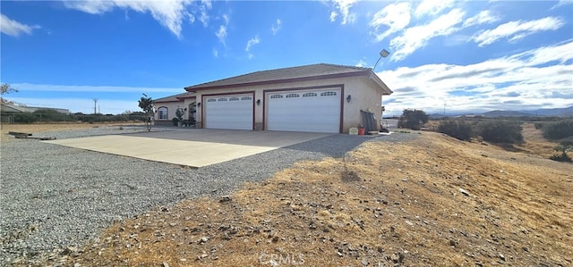 garage featuring a mountain view