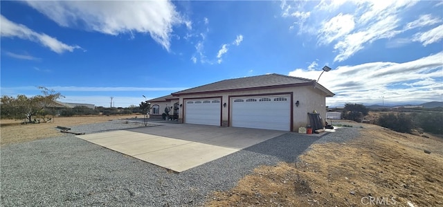 view of home's exterior featuring an outbuilding and a garage