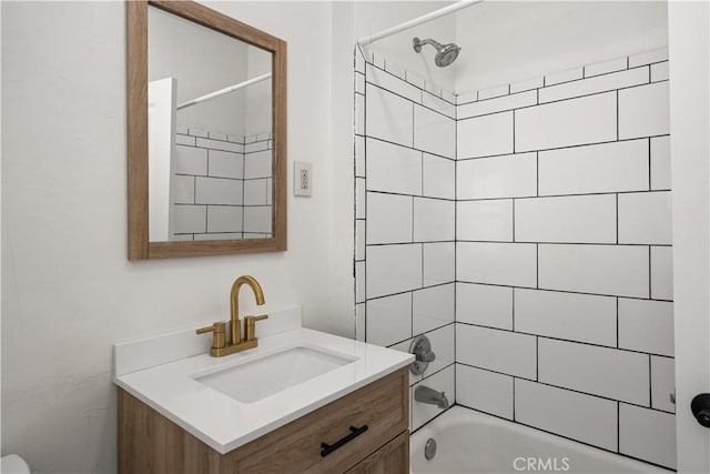 bathroom with vanity and tiled shower / bath combo