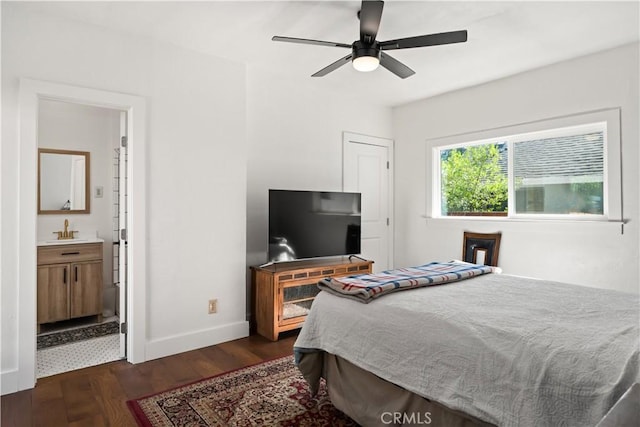 bedroom with connected bathroom, ceiling fan, dark hardwood / wood-style flooring, and sink