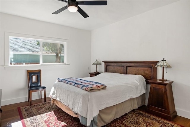 bedroom featuring ceiling fan and dark wood-type flooring